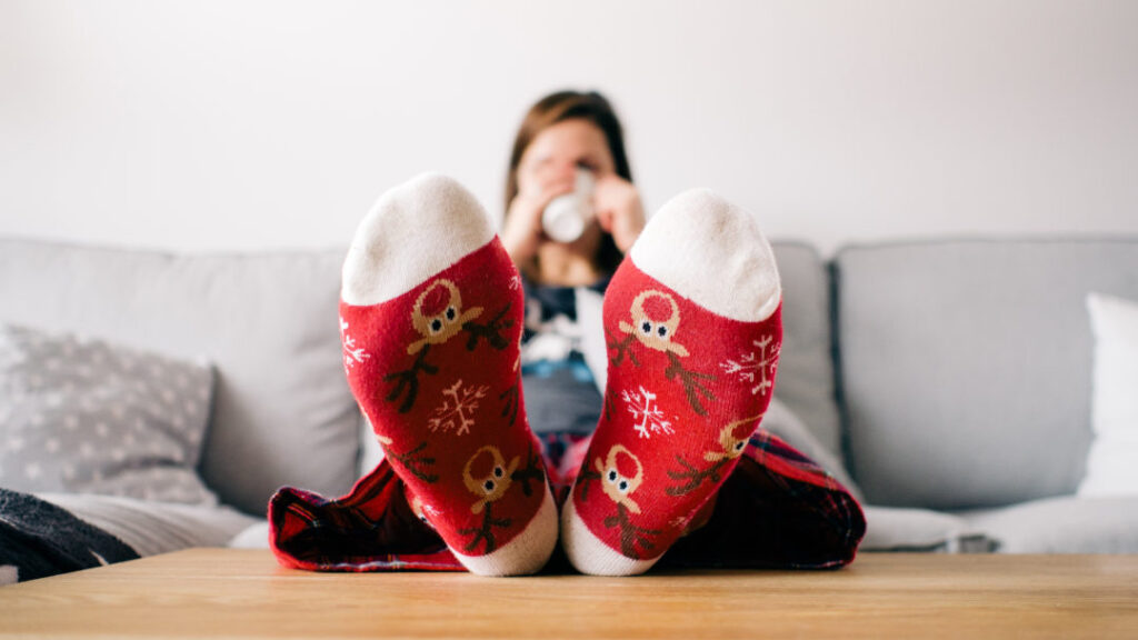 woman staying grounded in holiday socks